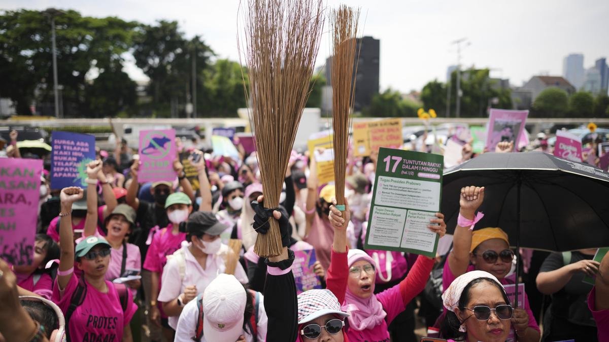 Brandishing brooms, Indonesian women join Jakarta protests